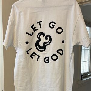 White “Let Go & Let God” Graphic Tee.